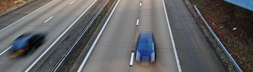 Car driving on dual carriageway