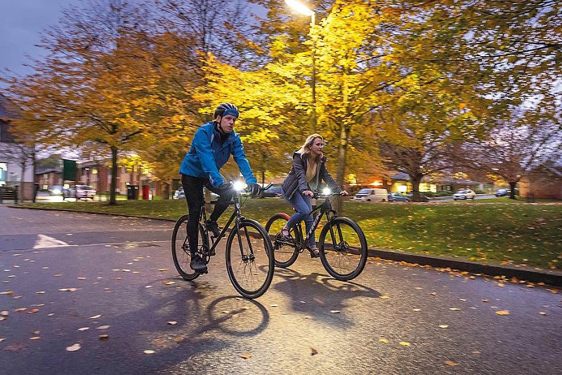 Cyclists riding with their lights on